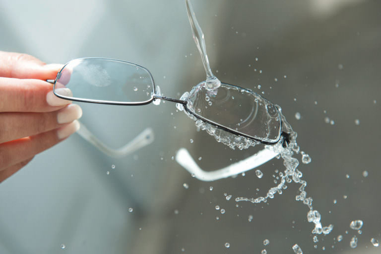 Water being poured on lenses coated with DuraVision Platinum.