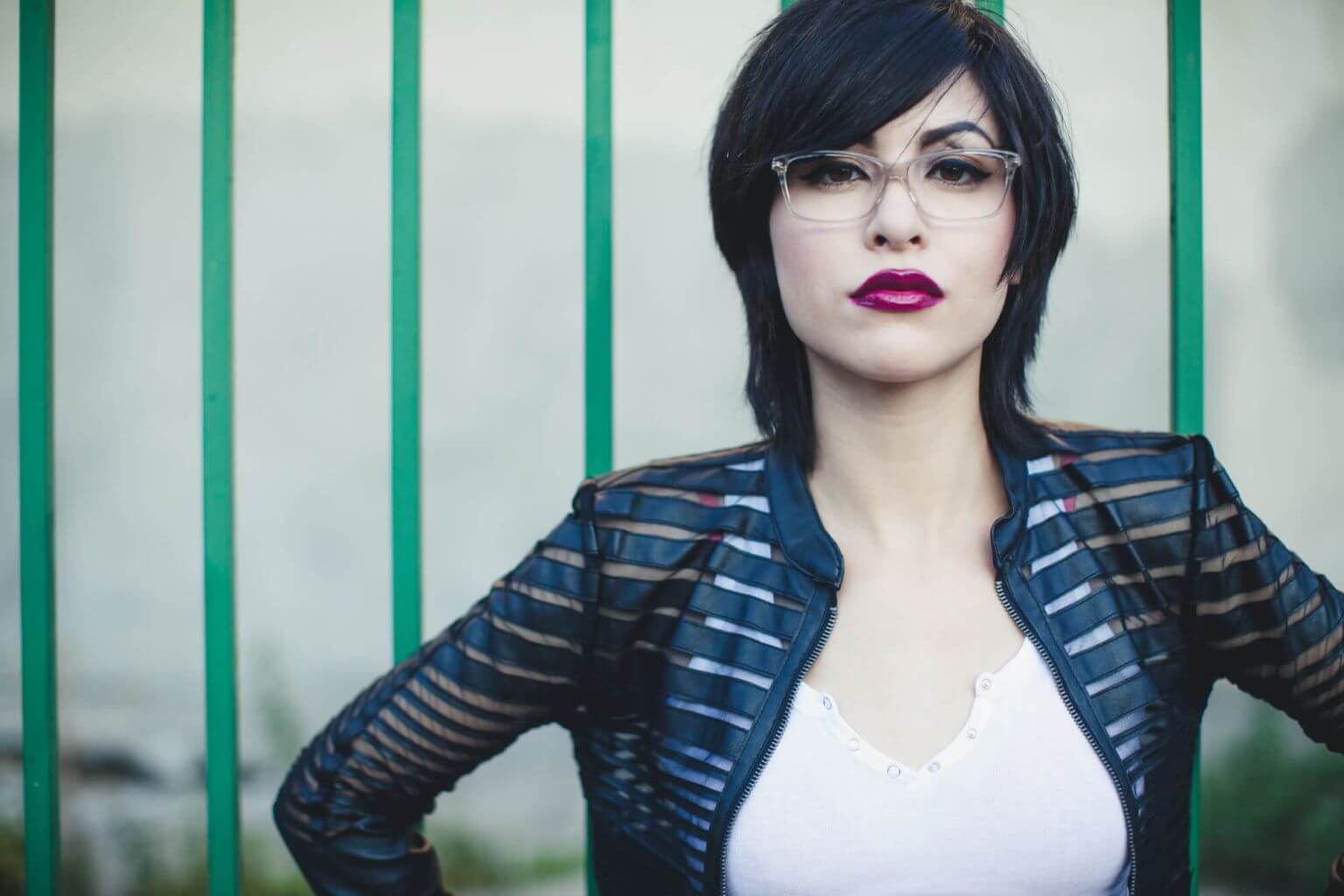 Woman wearing Klein 1991 Giorgia plastic eyeglass frames in crystal.