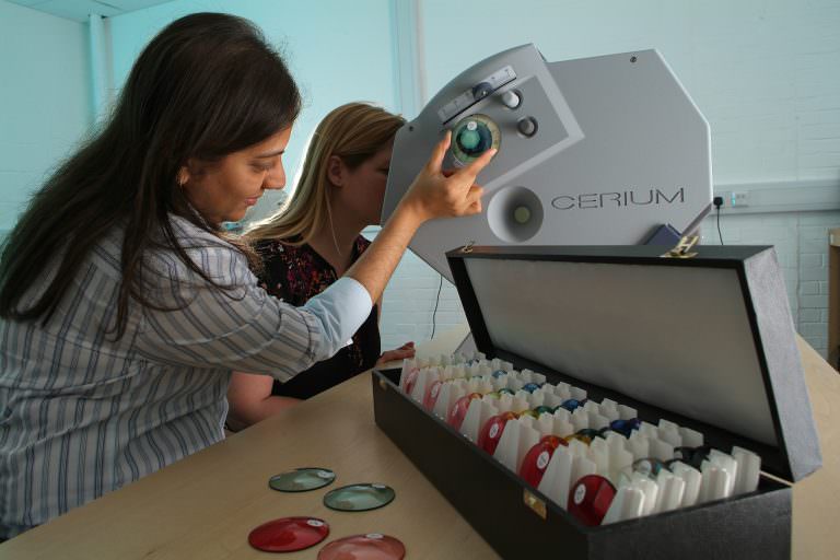 A Colourimetry Specialist performs tests to determine client's optimal filter colour.