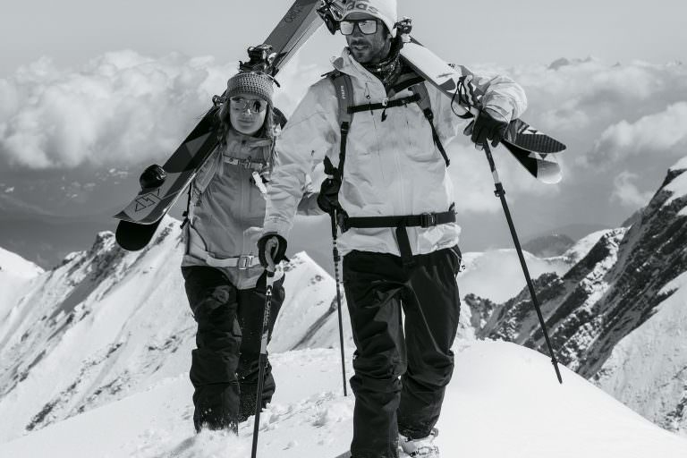 n and man climbing mountain wearing adidas Sport Eyewear Wildcharge and 3Matic sunglasses.