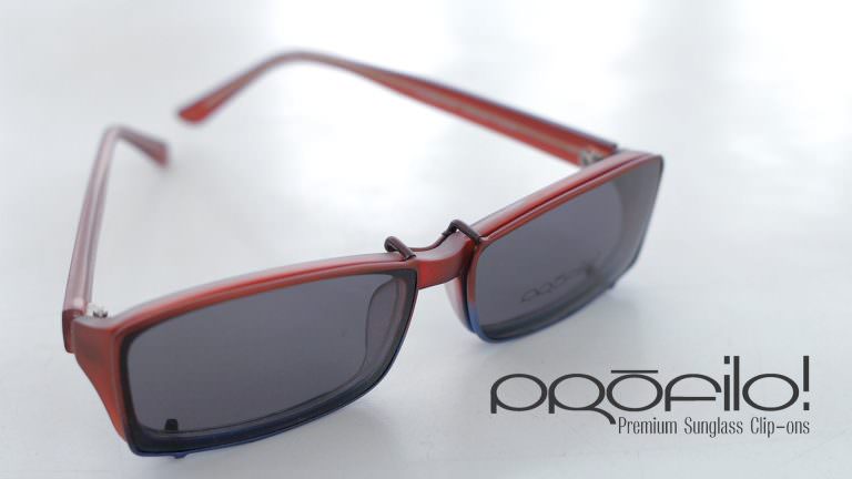 A plastic eyeglass frame fitted with custom PROFILO! Premium sunglass clip-ons.