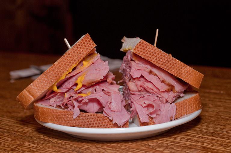 Smoked Meat Sandwich on light rye bread by Dunn's Famous.